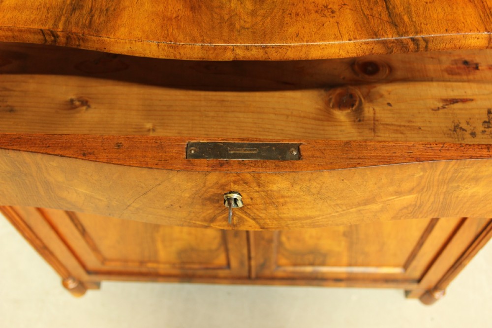 A Serpentine 19th century French Walnut two door sideboard. View VIII