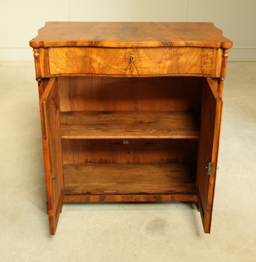 A Serpentine 19th century French Walnut two door sideboard. View IX