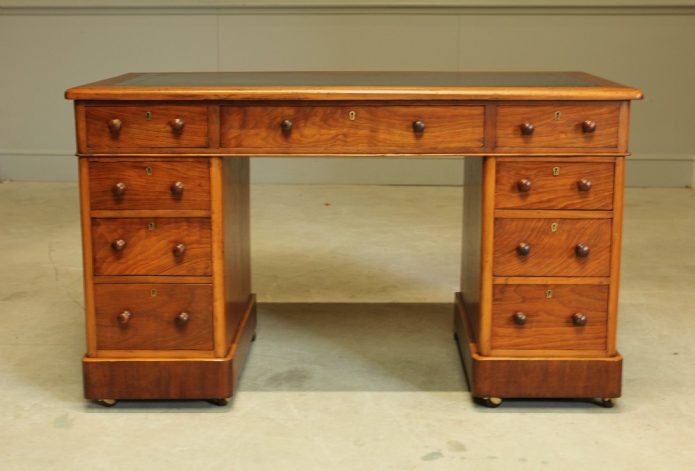 A VICTORIAN WALNUT TWIN PEDISTAL WRITING DESK.