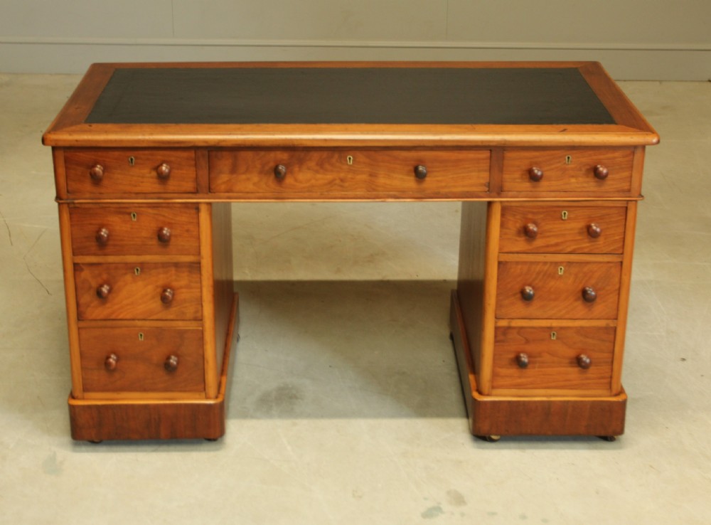 A VICTORIAN WALNUT TWIN PEDISTAL WRITING DESK. View II