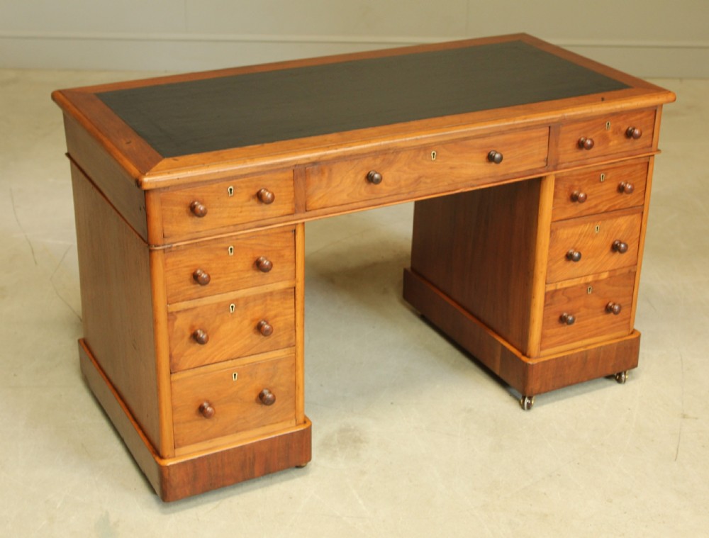 A VICTORIAN WALNUT TWIN PEDISTAL WRITING DESK. View III