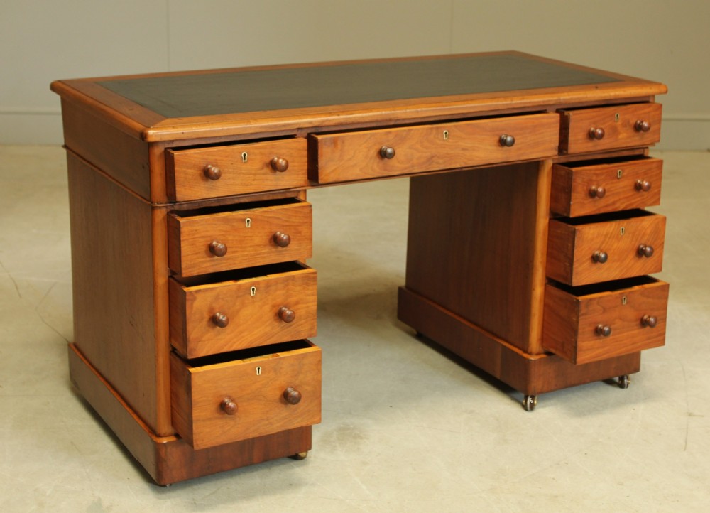 A VICTORIAN WALNUT TWIN PEDISTAL WRITING DESK. View IV