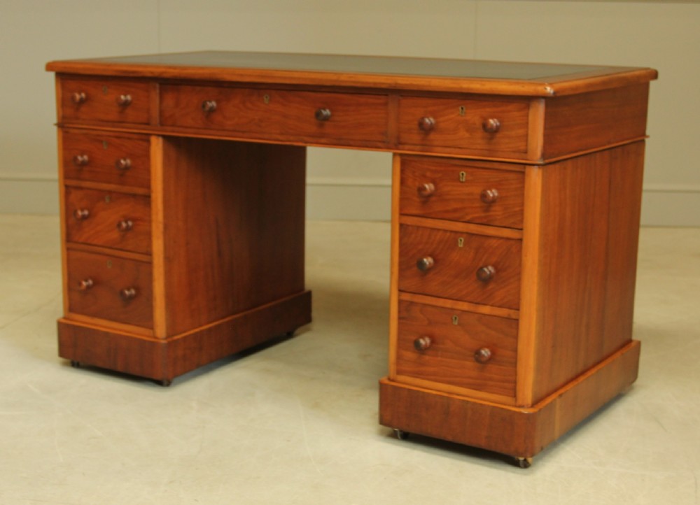 A VICTORIAN WALNUT TWIN PEDISTAL WRITING DESK. View VI