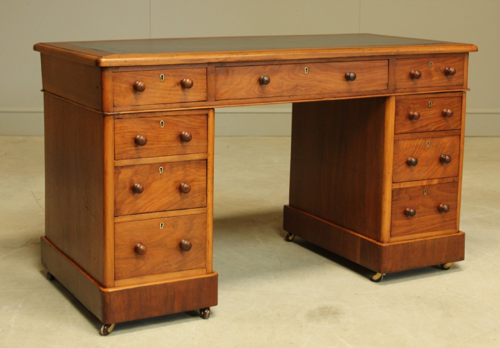 A VICTORIAN WALNUT TWIN PEDISTAL WRITING DESK. View VII