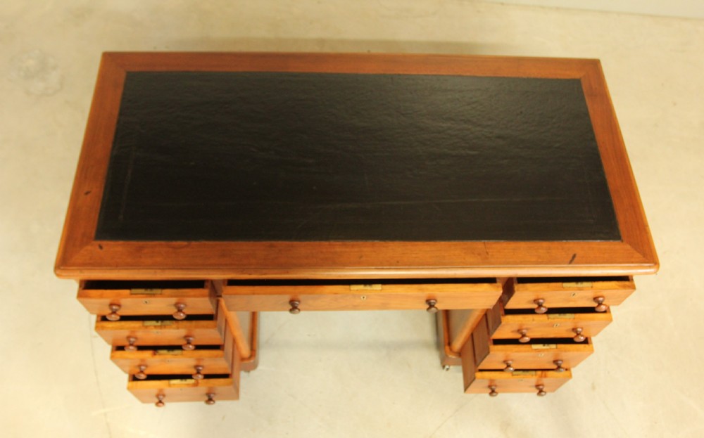 A VICTORIAN WALNUT TWIN PEDISTAL WRITING DESK. View VIII