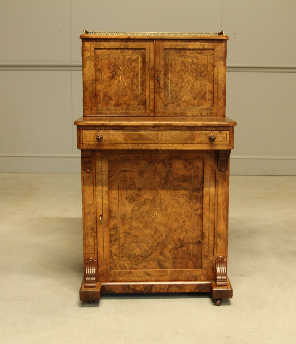 A VICTORIAN BURR WALNUT DAVENPORT
