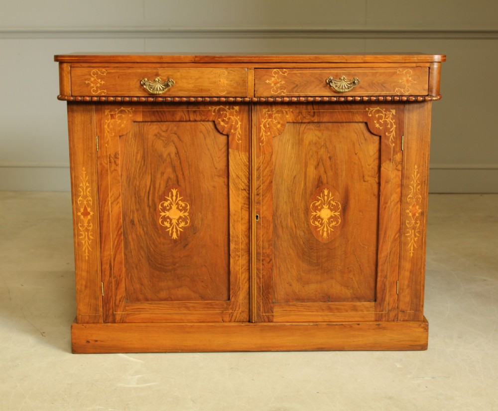 A Victorian walnut two door sideboard.