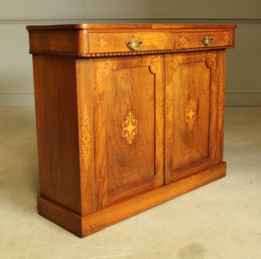 A Victorian walnut two door sideboard. View II