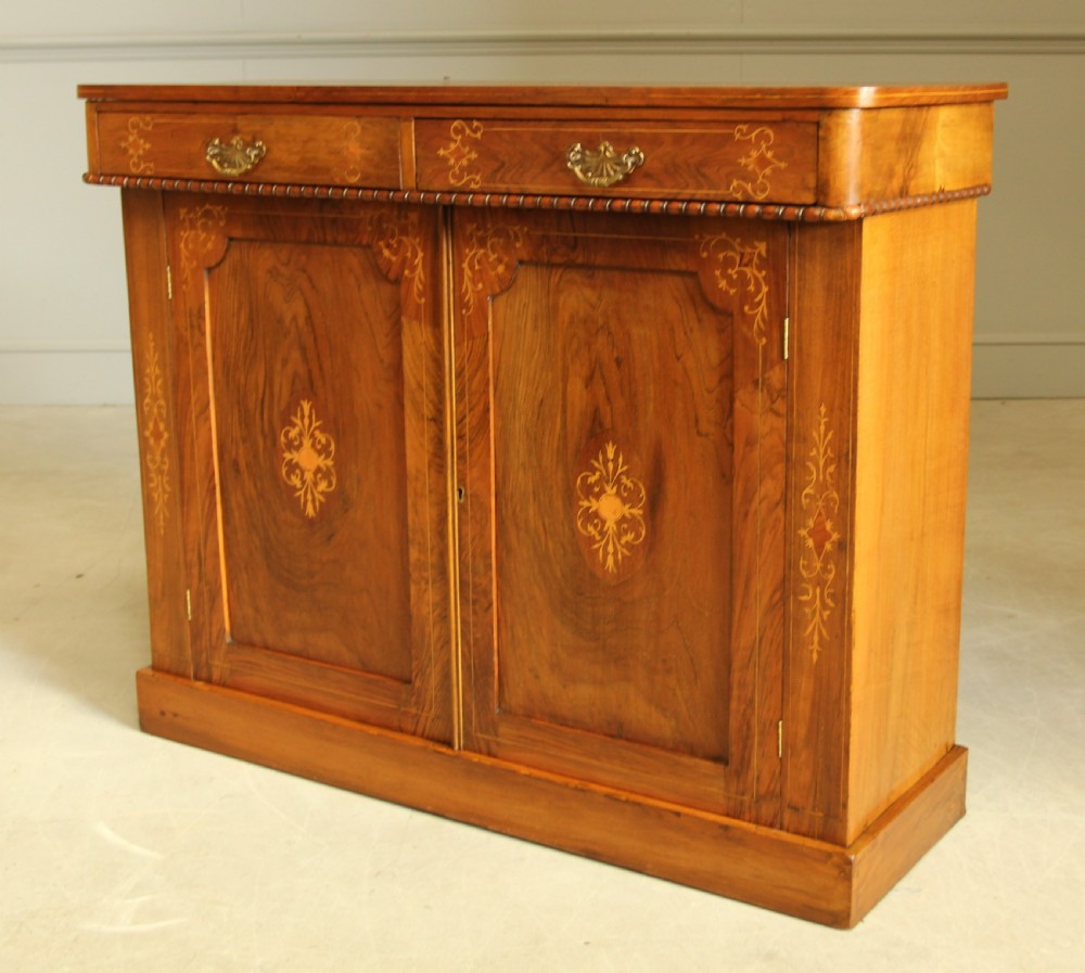 A Victorian walnut two door sideboard. View III