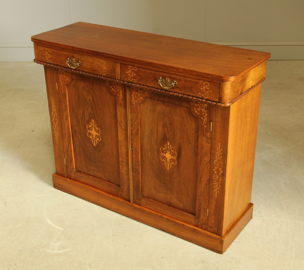 A Victorian walnut two door sideboard. View IV