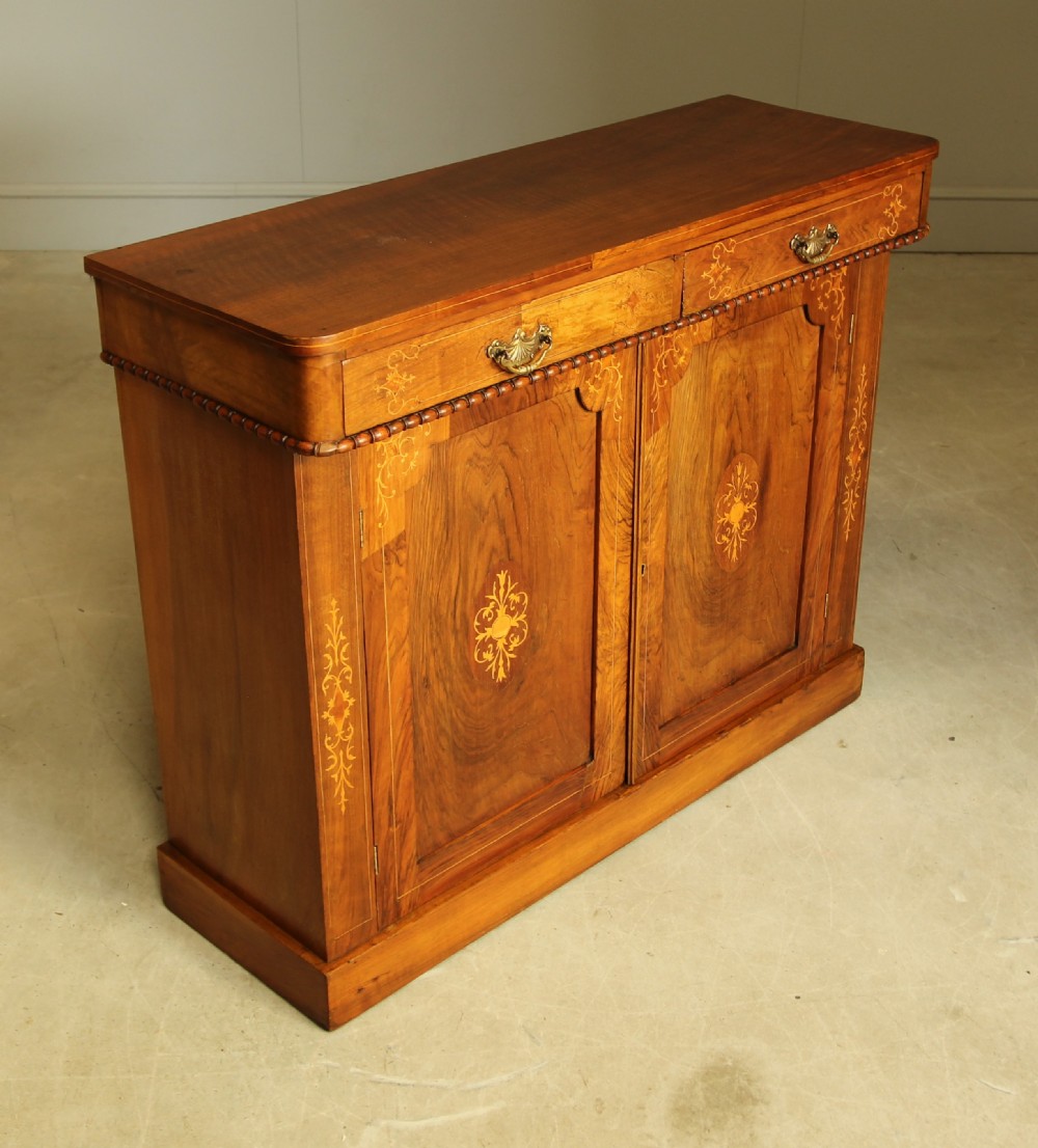A Victorian walnut two door sideboard. View V
