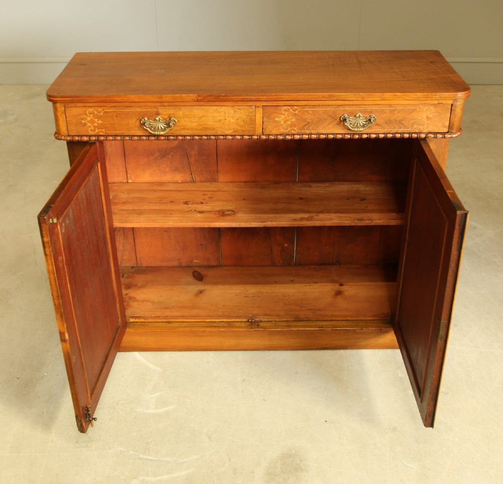 A Victorian walnut two door sideboard. View VII