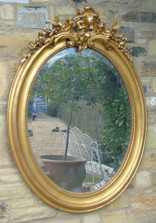 Large Antique French Oval Giltwood and Gesso Mirror