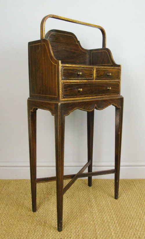 A Regency Style Simulated Rosewood And Parcel Gilt Chevret Table