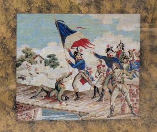 fig 2. A square gilt-framed tapestry embroidery depicting Napoleon Bonaparte raising the tricolour flag at the Battle of Arcole.