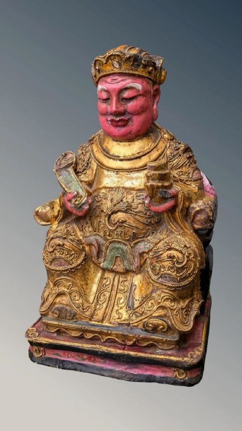 CHINESE POLYCHROME CARVED FIGURE OF A DEITY QING PERIOD