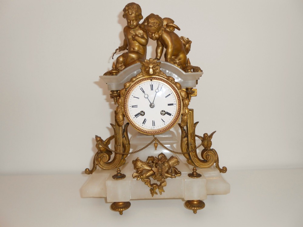 French Alabaster and Gilt Metal Mantle Clock