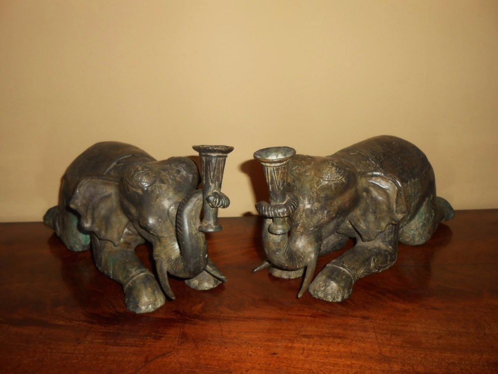 Pair of Indian Bronze Recumbent Elephant Candlestick Ornaments