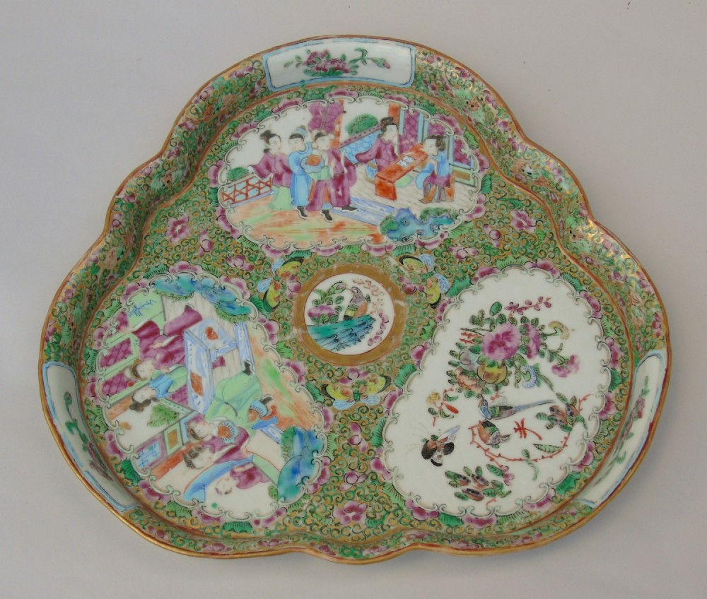 A three-lobed Chinese porcelain tray decorated with hand-painted figure panels, birds, and flowers in pink and green enamels with gilded accents.