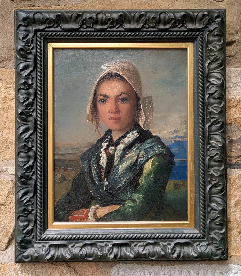 An antique oil painting on board depicting a young girl in traditional dress and bonnet, framed in a dark carved frame with a gold inner border.