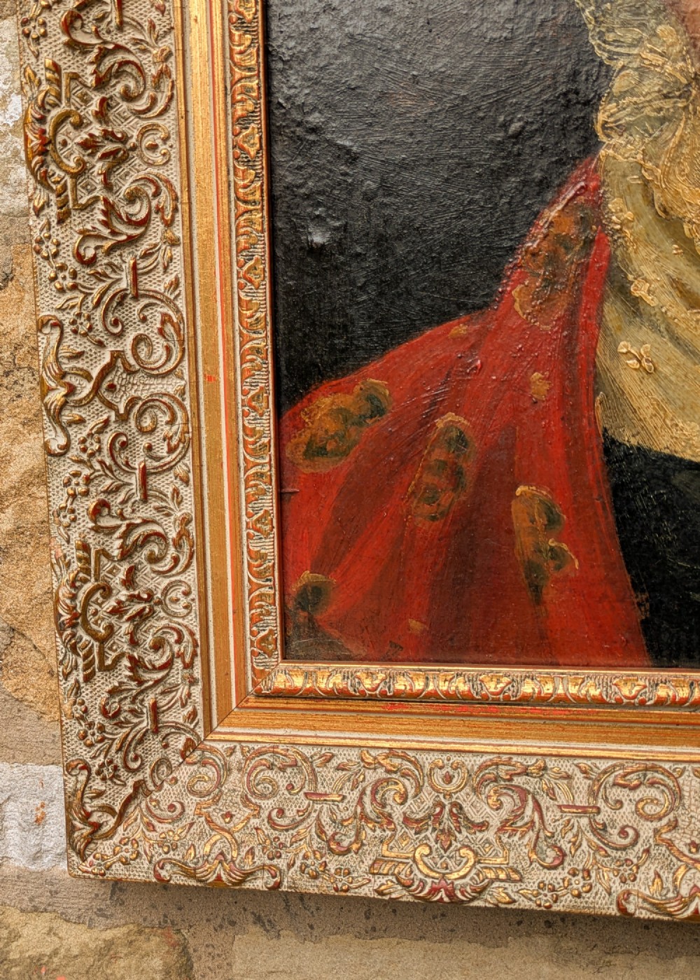An antique 19th-century oil portrait depicting an elderly woman in a lace cap and red patterned shawl, framed in a carved gilt wood frame. View IV