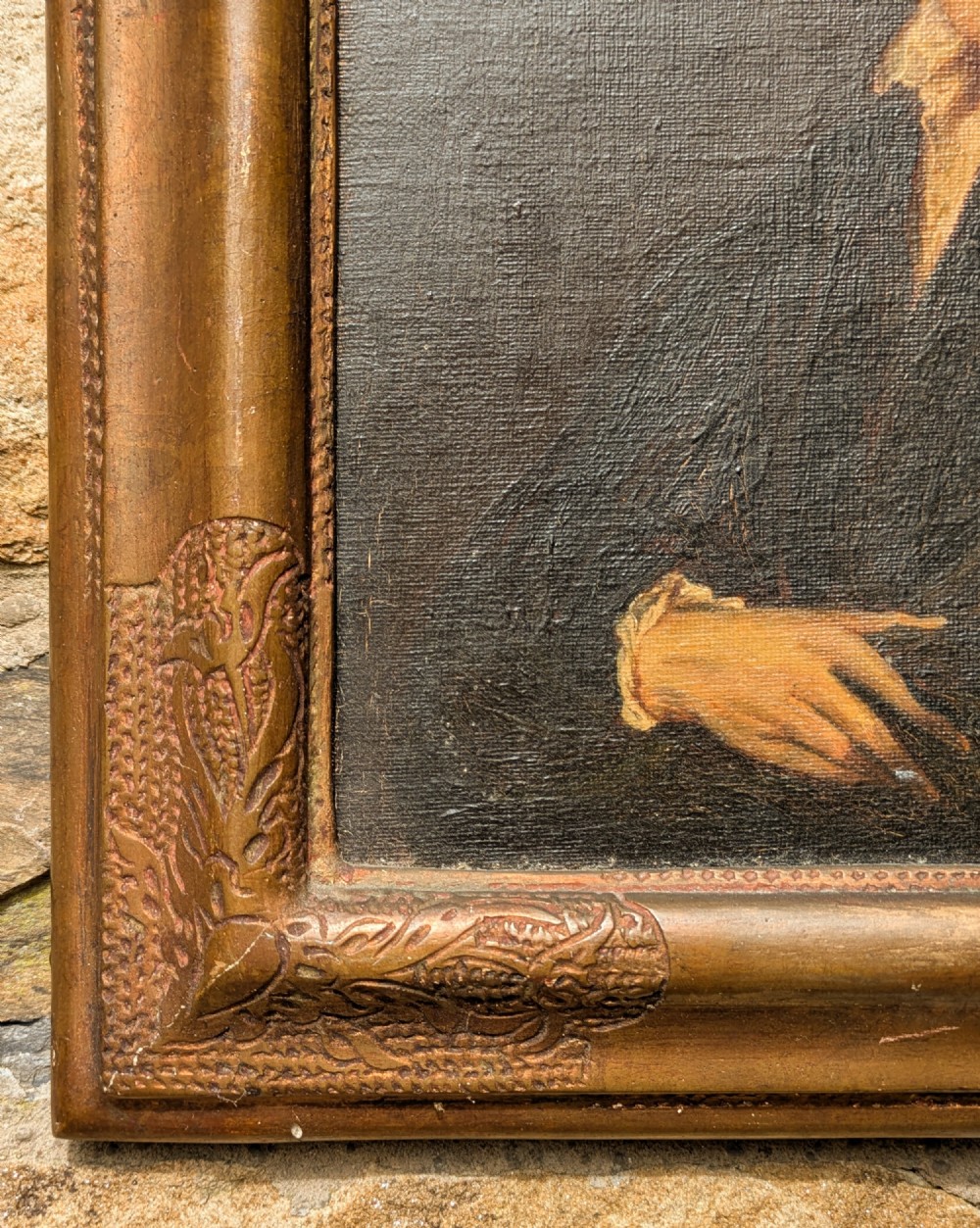 An antique oil painting depicting a young gentleman with dark wavy hair and an open collar set within a decorated metallic gilt frame. View III