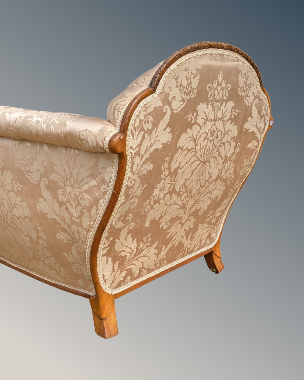 An antique French armchair featuring a carved walnut frame, button-tufted back, and champagne silk damask upholstery. View VII