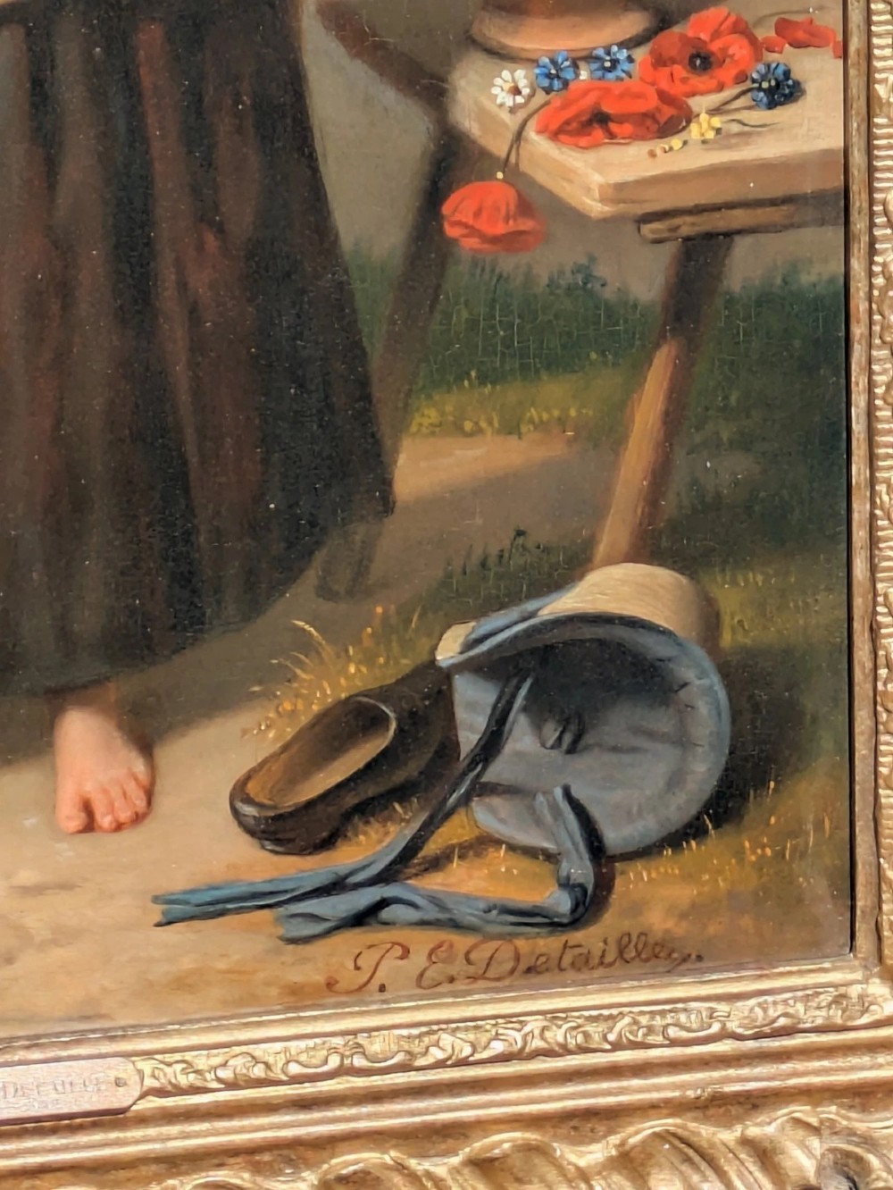 A 19th-century oil painting depicting a barefoot young woman standing outdoors in front of a cottage wall beside potted flowers, set within a deeply carved gilt frame. View IV