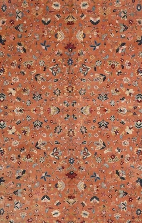 An antique hand-knotted Tabriz carpet featuring a terracotta central field decorated with intricate floral motifs and framed by layered ivory and navy decorative borders. View II