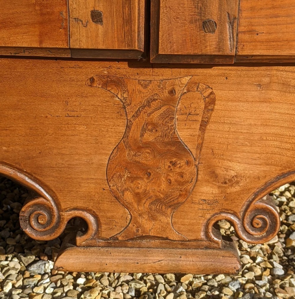 A French provincial fruitwood pantry cabinet featuring upper spindle-front doors, two central drawers with steel handles, lower solid panel doors, and carved cabriole feet. View IX