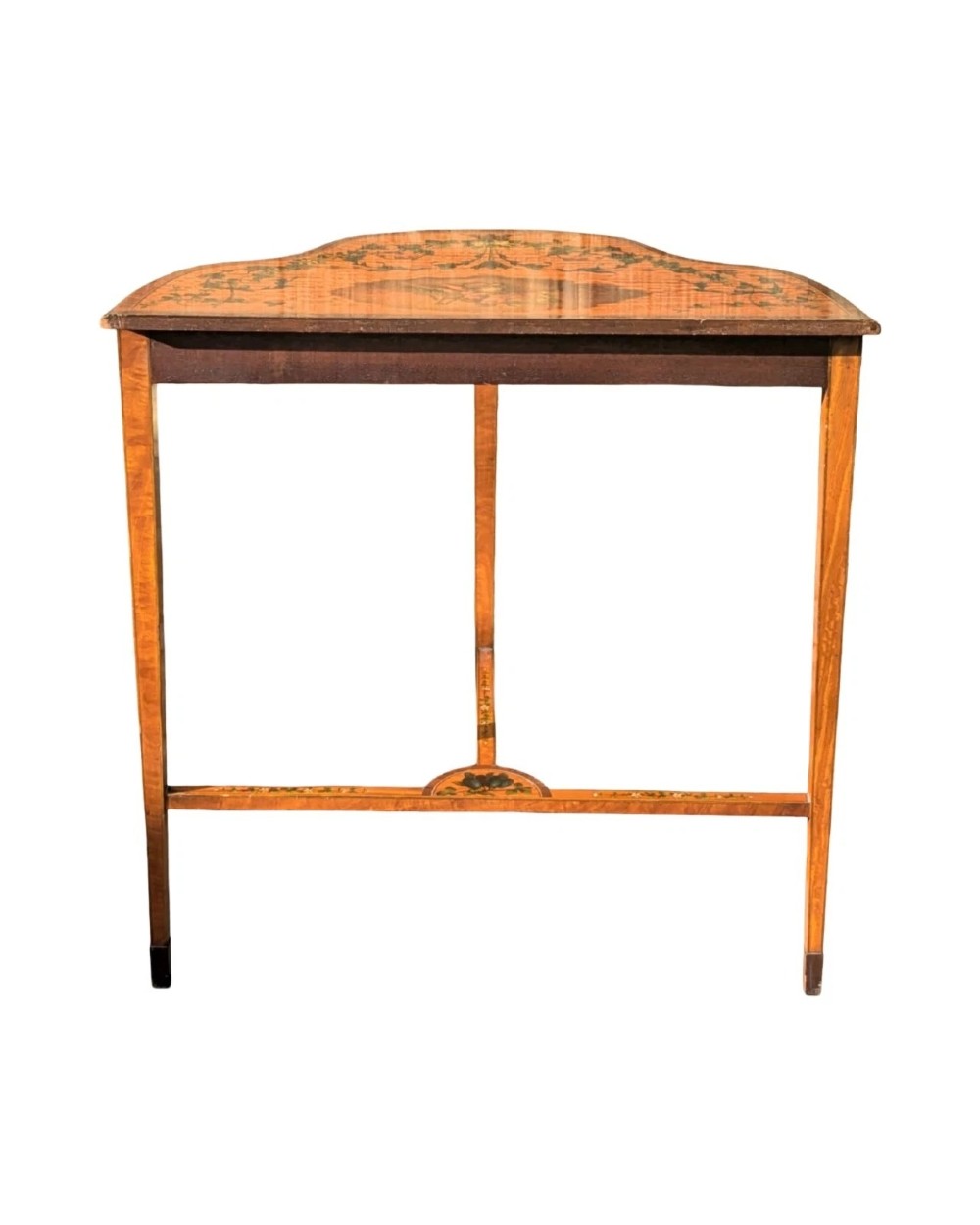 A Regency satinwood side table with a shaped top decorated with hand-painted floral swags and a central cherub medallion, supported by slim tapering legs. View VIII