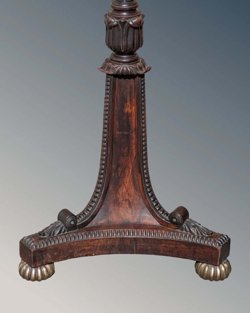 A dark rosewood Regency standard lamp featuring a barley twist column, a carved triform base with brass feet, and a cream fabric shade. View II