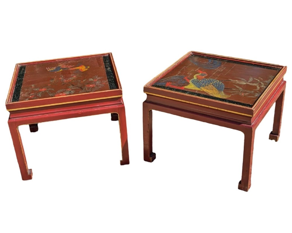 A pair of square Chinese low tables with red lacquered frames and hand-painted tops depicting birds among foliage.