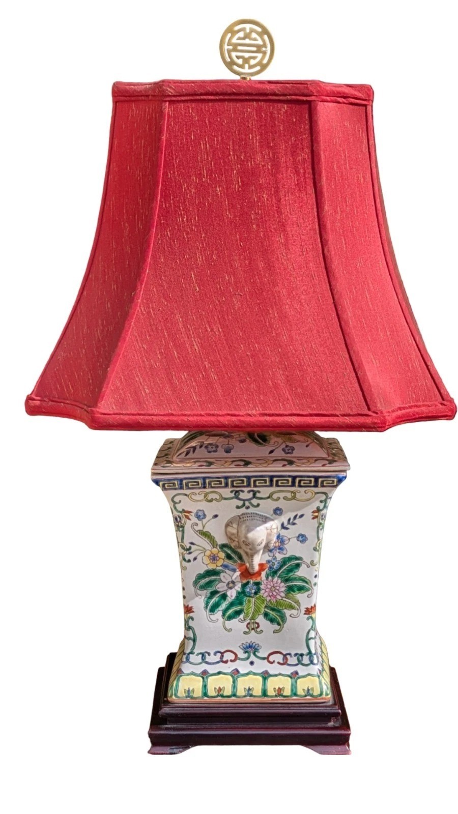 A pair of Chinese porcelain table lamps featuring hand-painted floral motifs and relief elephant details, topped with red silk shades. View VI