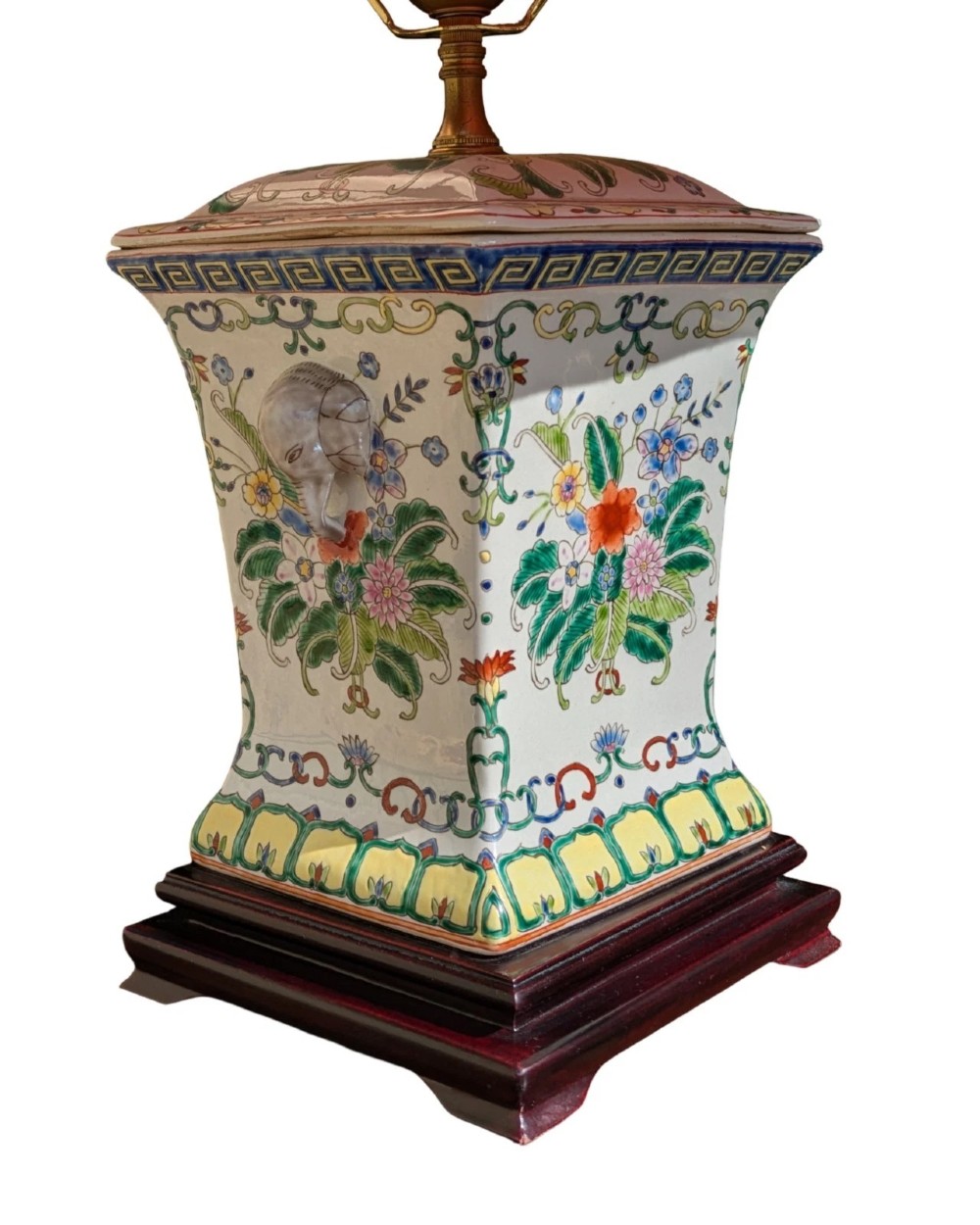 A pair of Chinese porcelain table lamps featuring hand-painted floral motifs and relief elephant details, topped with red silk shades. View VIII