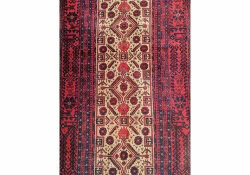 An antique Balouch tribal carpet featuring a cream central field with geometric diamond motifs surrounded by a deep red and navy blue geometric border. View II