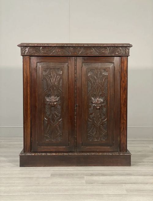 19TH CENTURY CARVED OAK CUPBOARD - ADDITIONAL PHOTO 1