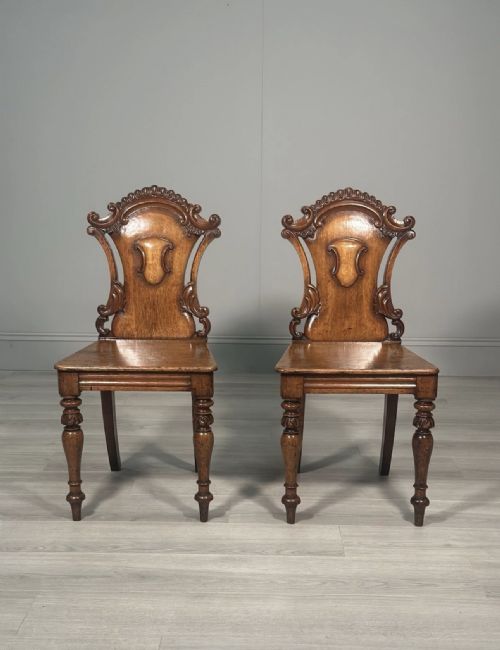 A PAIR OF OAK HALL CHAIRS C1860