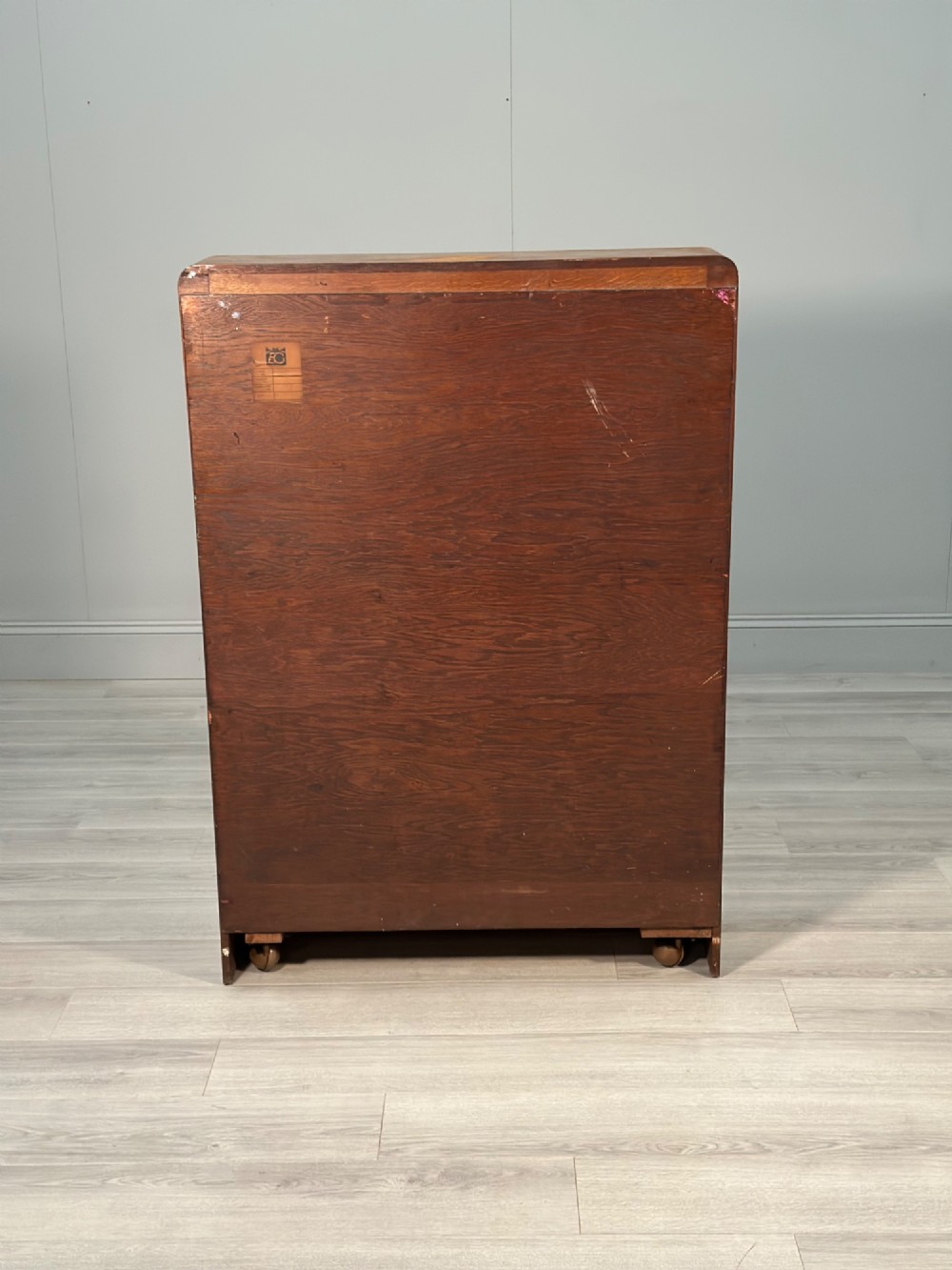 An Art Deco oak bureau bookcase featuring an open top shelf, drop-down writing flap, a glazed side cabinet, and lower cupboards with geometric diamond veneer. View XIV