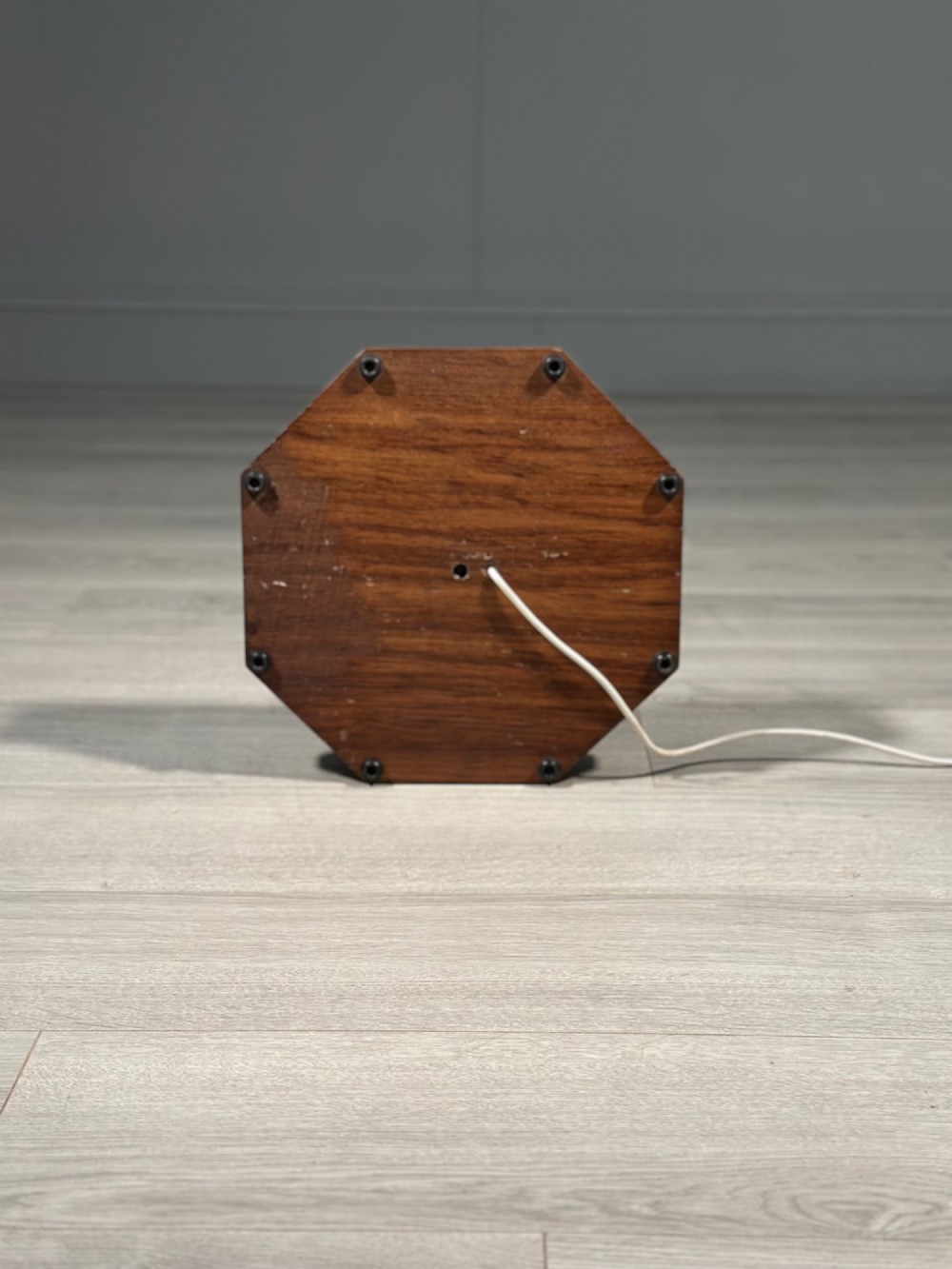 A tall Arts and Crafts solid oak standard lamp featuring a faceted stem mounted on an octagonal base with a brass light socket. View VIII