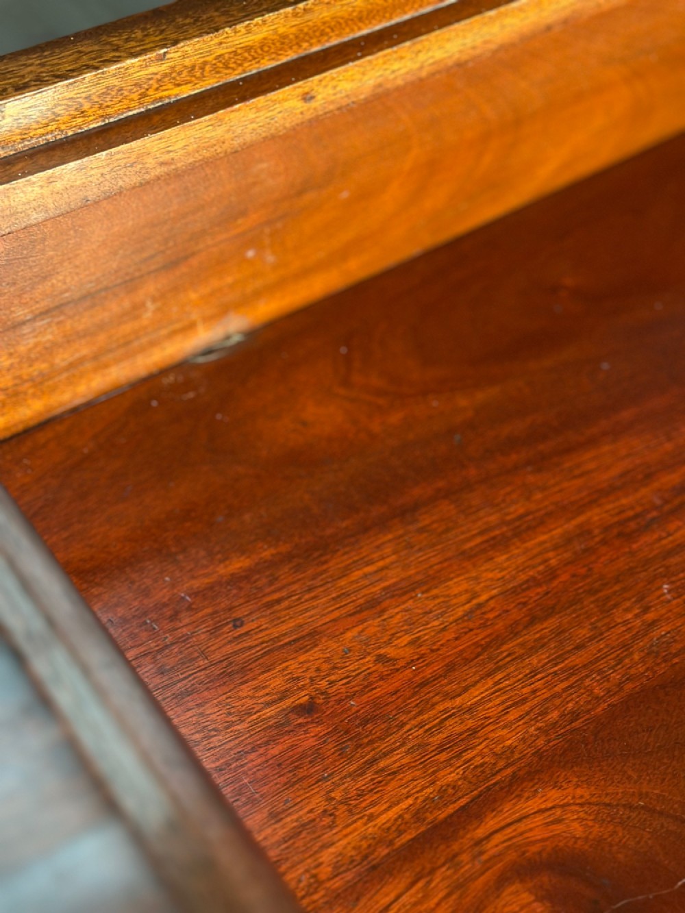 An Edwardian mahogany pedestal sideboard featuring two outer pedestal cupboards, central drawers, and brass drop handles. View XI