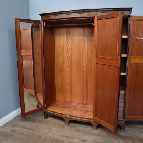 fig 1. Edwardian mahogany bow front triple wardrobe