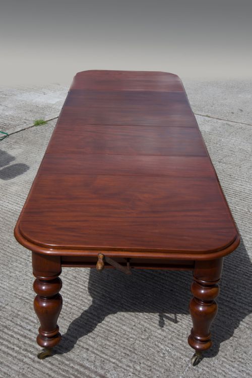 fig 1. Large Antique Victorian five leg extending mahogany dining table