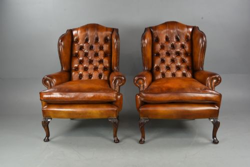 Antique Pair of Deep Buttoned Leather Wing Chairs