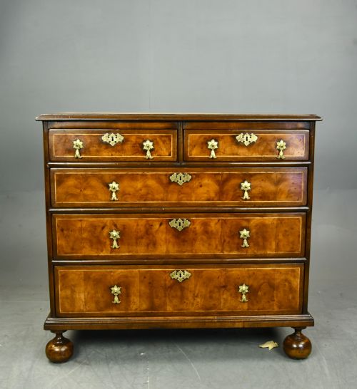 fig 1. 18th century oyster and walnut chest of drawers