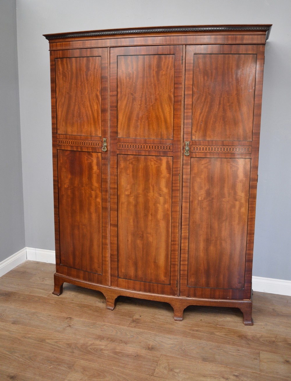 Edwardian mahogany bow front triple wardrobe 