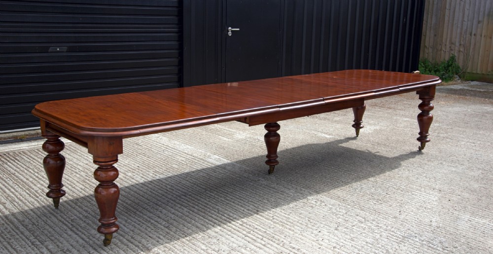 Large Antique Victorian five leg extending mahogany dining table 