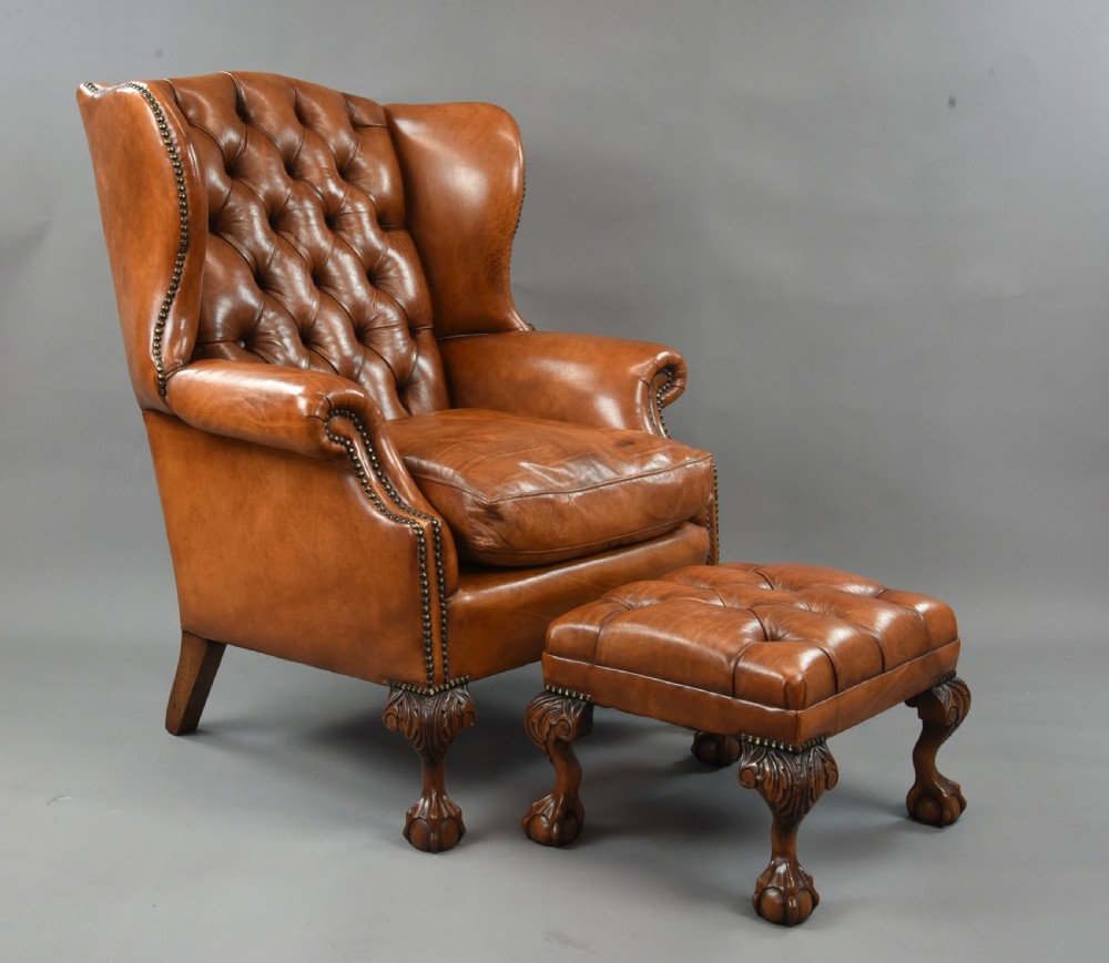 large Antique deep buttoned leather wing chair 