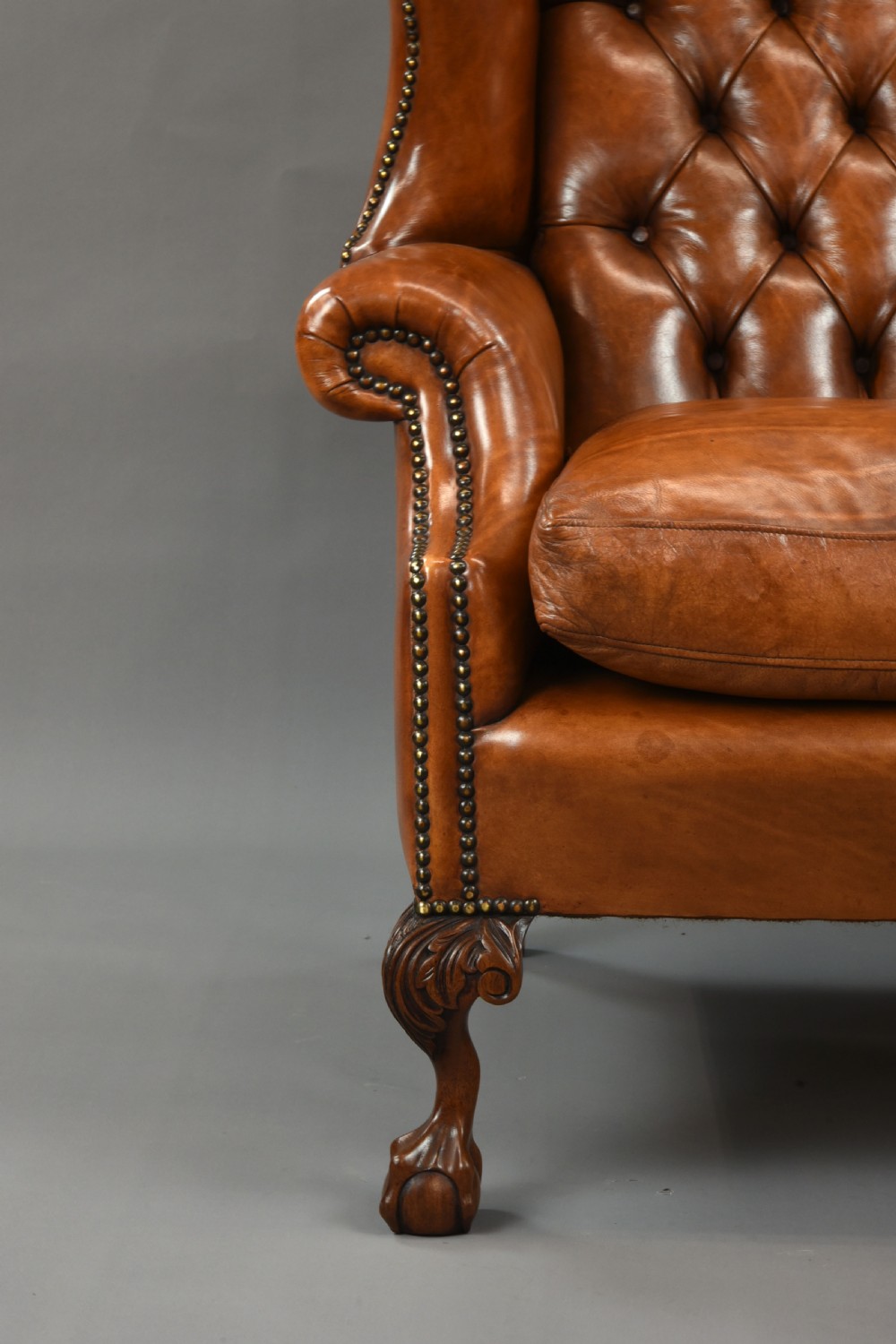 large Antique deep buttoned leather wing chair  View VIII