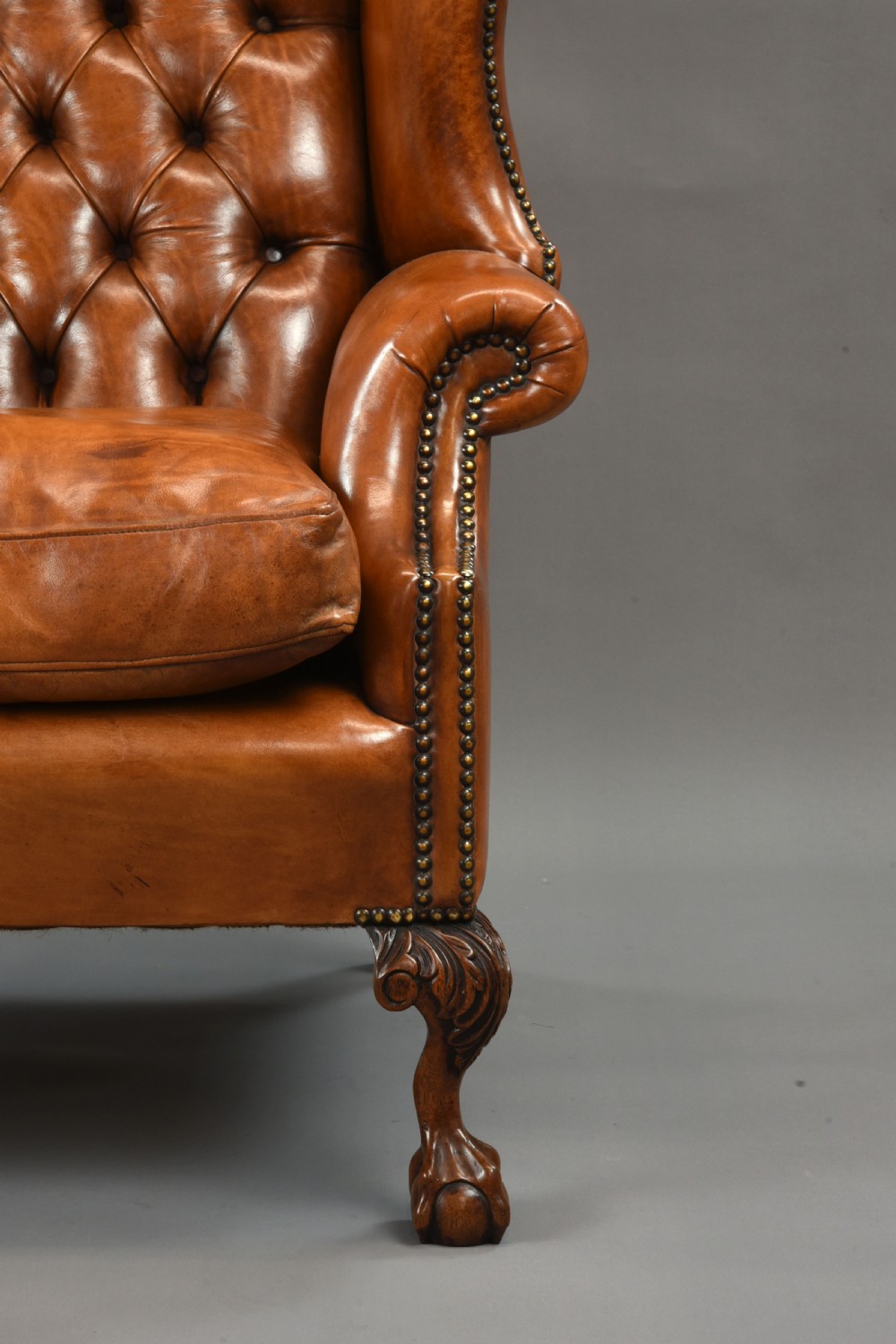 large Antique deep buttoned leather wing chair  View IX